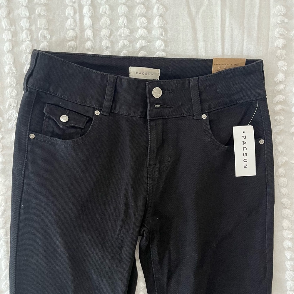 BLACK LOW RISE FLARE JEANS PACSUN